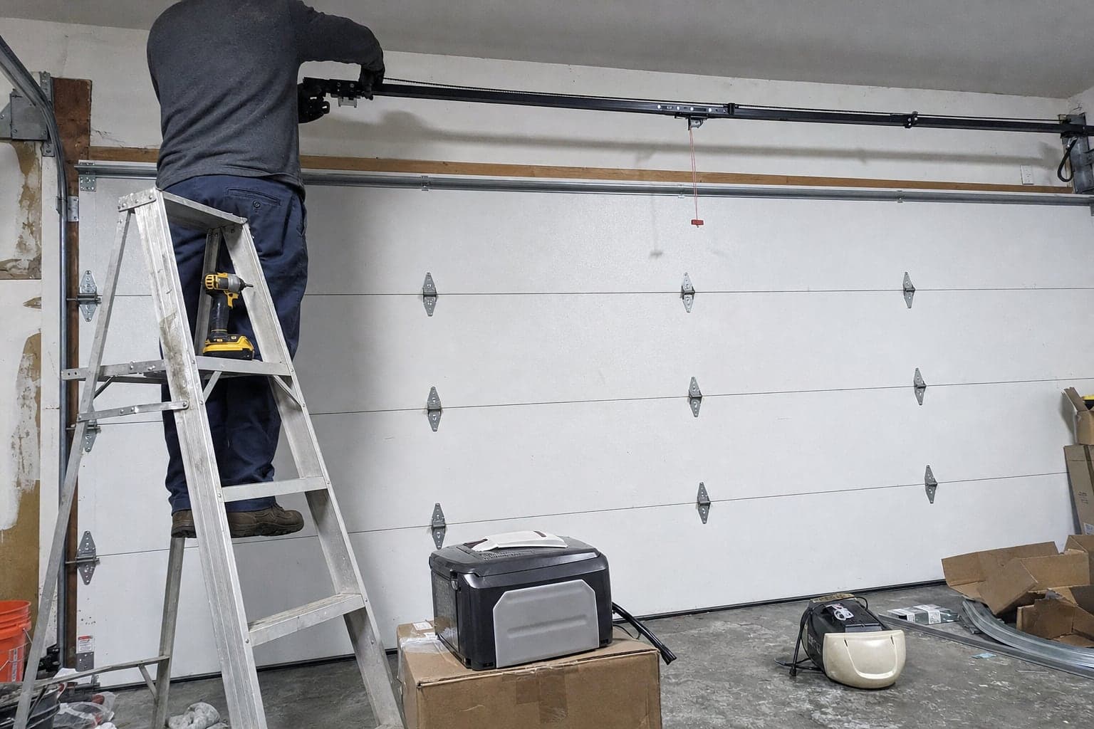 Installing a belt-drive opener rail in a home garage