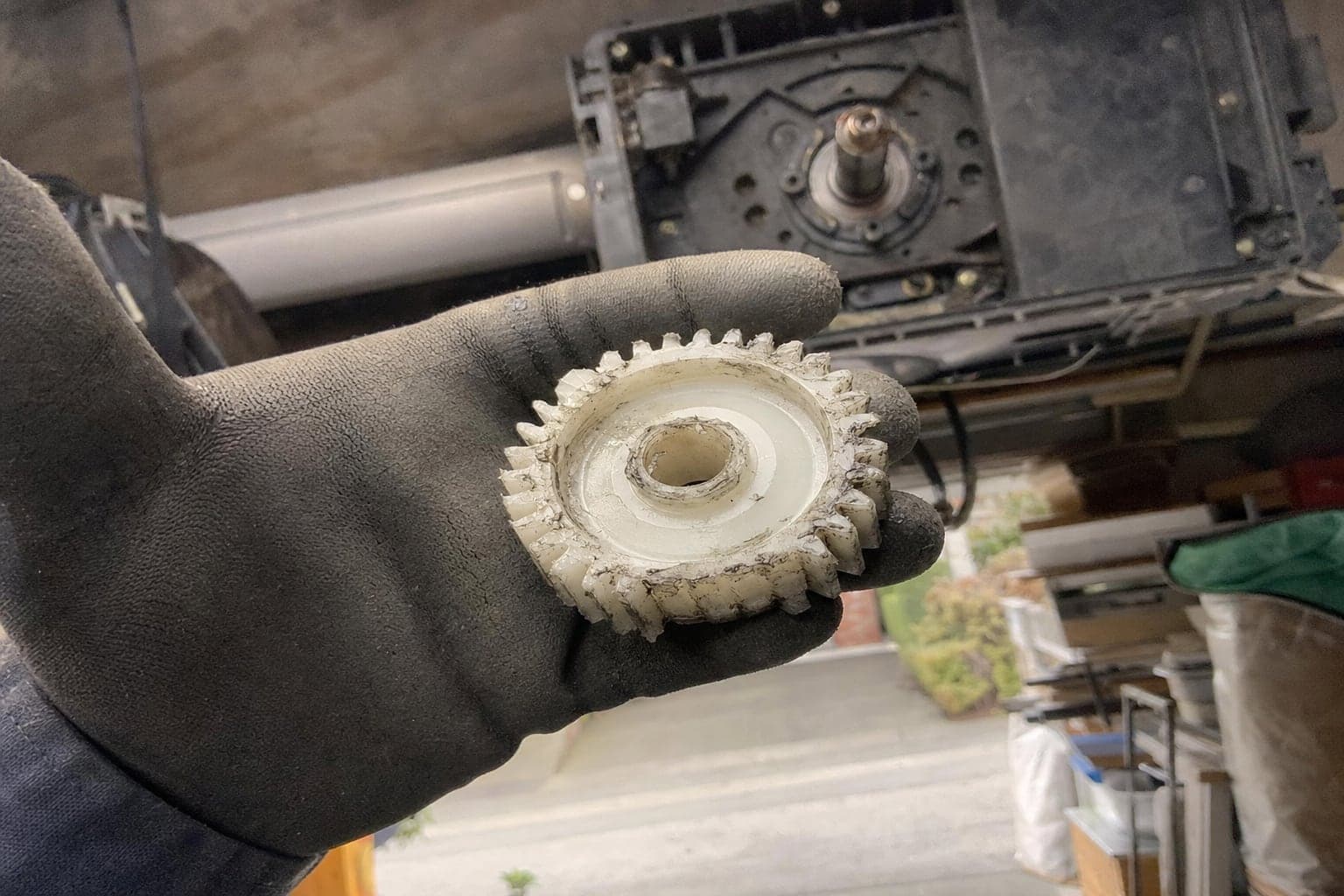 Worn plastic drive gear from a garage door opener