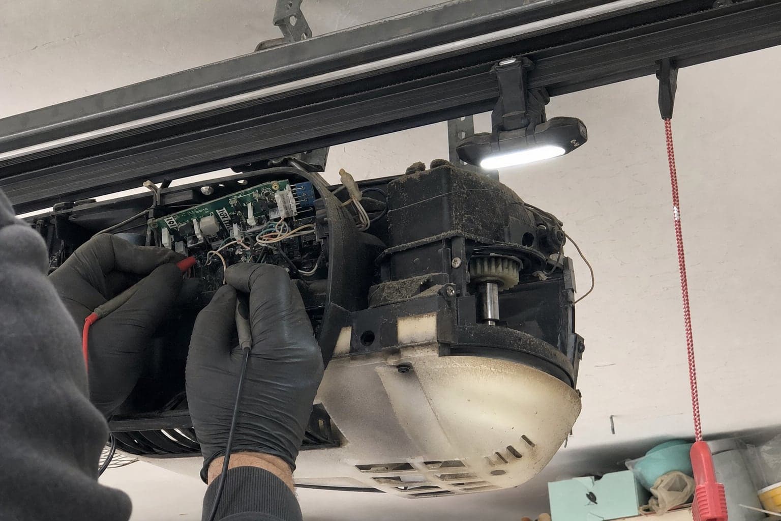 Checking the circuit board of a garage door opener